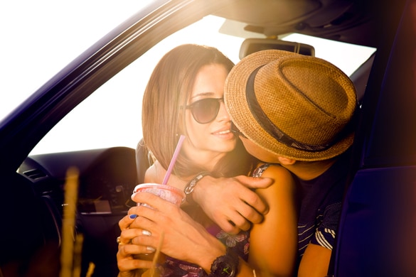 romantic-capricorn-woman-and-virgo-man-sitting-on-the-hood-of-their-car-while-out-on-a-roadtrip