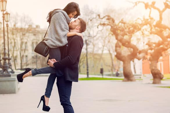 Attractive fashion couple posing on the old street in sunny fall - why women find a virgo man so sexy